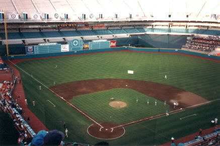 Florida Marlins ball players stand on the field as the Canadian national  anthem is played before the game against the Montreal Expos, Wednesday,  April 10, 2002, at Pro Player Stadium in Miami.